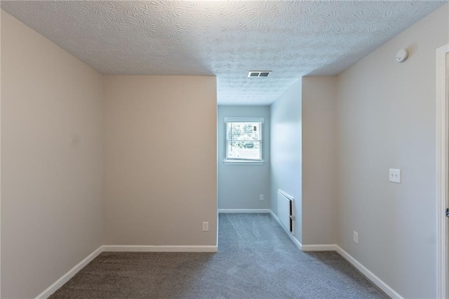 1406 Windy Ridge Ct SE, Conyers, GA 30013 - spare room with carpet floors, a textured ceiling, and baseboards
