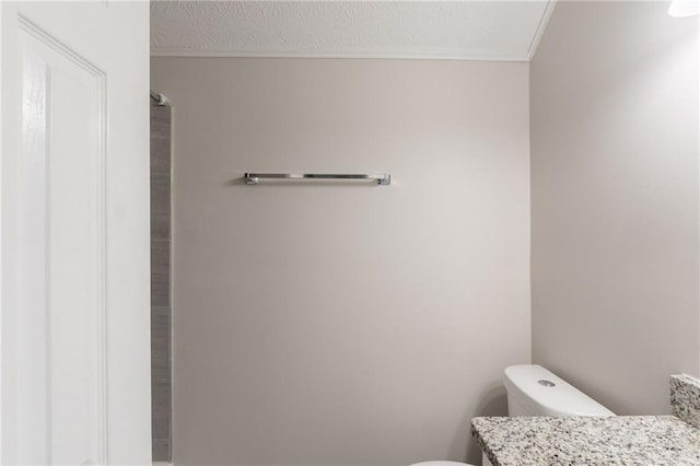 1406 Windy Ridge Ct SE, Conyers, GA 30013 - bathroom featuring toilet, vanity, and ornamental molding
