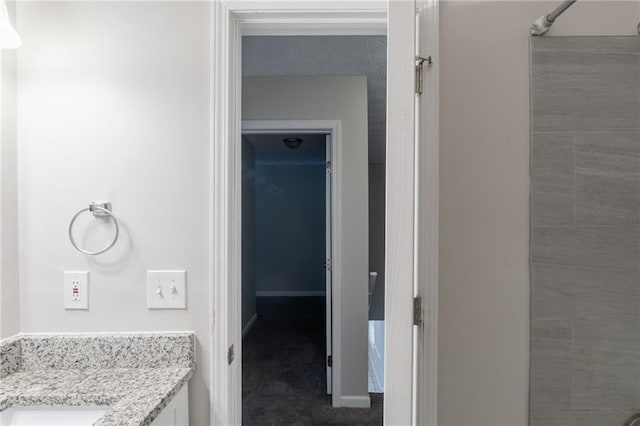 1406 Windy Ridge Ct SE, Conyers, GA 30013 - bathroom with vanity and baseboards