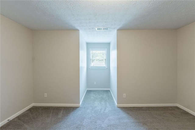 1406 Windy Ridge Ct SE, Conyers, GA 30013 - carpeted empty room featuring a textured ceiling and baseboards