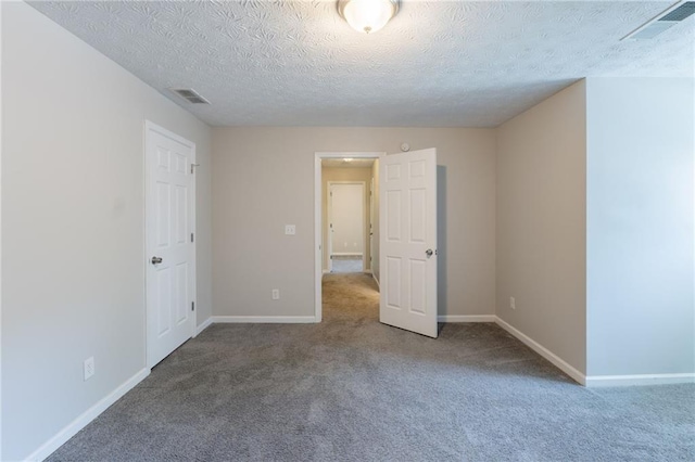 1406 Windy Ridge Ct SE, Conyers, GA 30013 - spare room featuring carpet, a textured ceiling, and baseboards