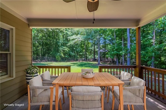 1406 Windy Ridge Ct SE, Conyers, GA 30013 - deck featuring outdoor dining area, ceiling fan, and view of scattered trees