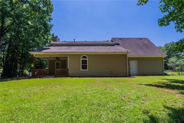 1406 Windy Ridge Ct SE, Conyers, GA 30013 - back of property featuring ceiling fan and a chimney