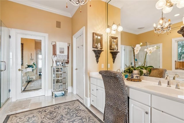 full bathroom featuring vanity, ornamental molding, a notable chandelier, and tile patterned floors