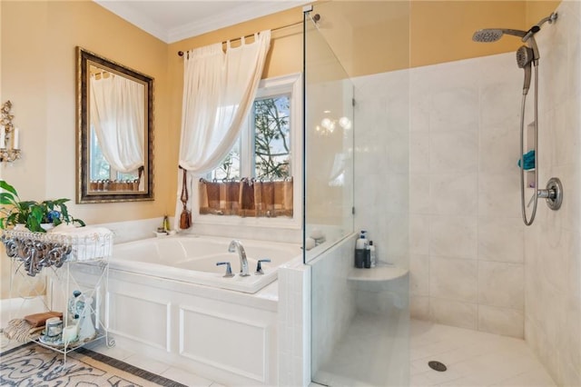 bathroom with a garden tub, crown molding, and tiled shower