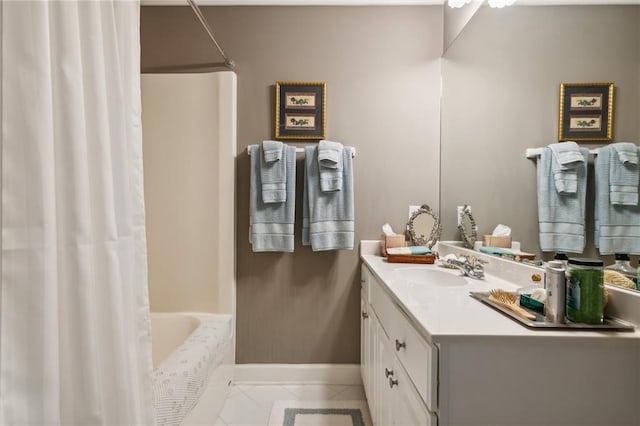 bathroom featuring tile patterned flooring, baseboards, shower / tub combo with curtain, and vanity