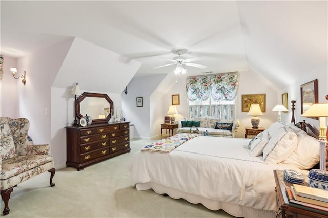 bedroom with light carpet, lofted ceiling, a ceiling fan, and baseboards