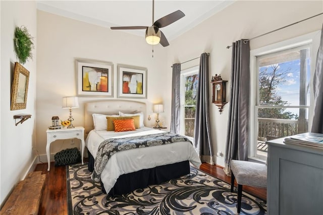 bedroom featuring a ceiling fan, dark wood-style flooring, and baseboards