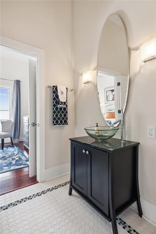 bathroom featuring baseboards and vanity