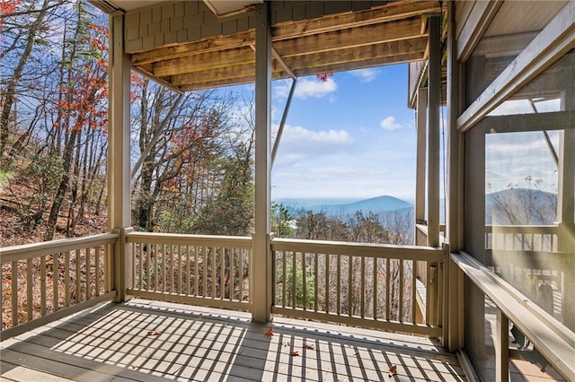 wooden terrace with a mountain view