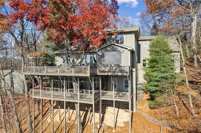 back of house with a balcony