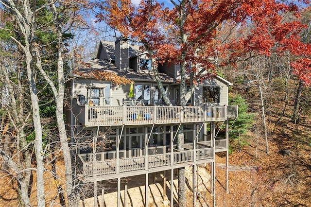 back of property featuring a chimney