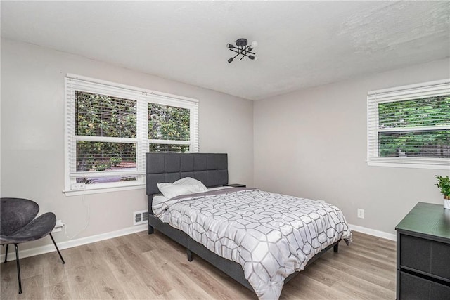 479 Charter Oak Dr SW, Atlanta, GA 30331 - bedroom with light wood-style flooring and baseboards