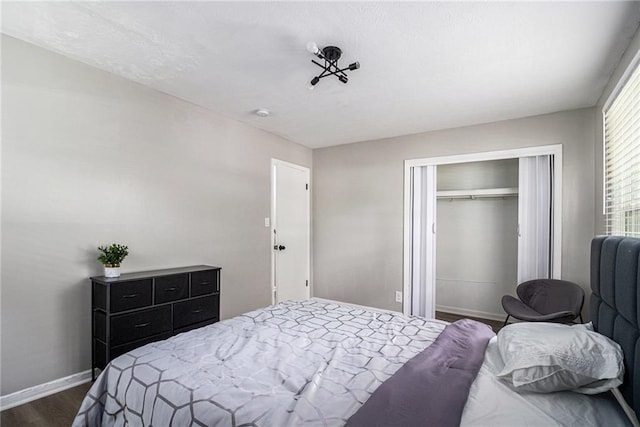 479 Charter Oak Dr SW, Atlanta, GA 30331 - bedroom featuring a closet, dark wood-style floors, and baseboards