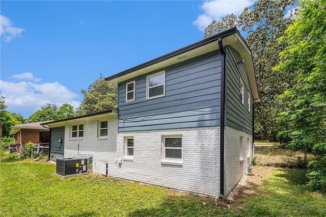 479 Charter Oak Dr SW, Atlanta, GA 30331 - back of house with brick siding, central AC, and a yard