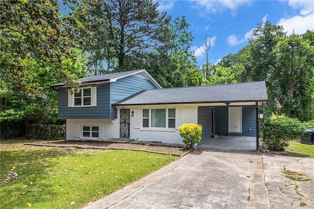 479 Charter Oak Dr SW, Atlanta, GA 30331 - split level home featuring concrete driveway, a front lawn, brick siding, an attached carport, and roof with shingles