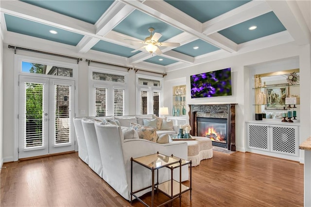 3663 Brookhaven Manor Xing NE, Atlanta, GA 30319 - living room with a fireplace, french doors, coffered ceiling, wood finished floors, and beamed ceiling