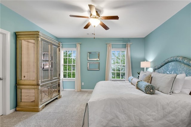 3663 Brookhaven Manor Xing NE, Atlanta, GA 30319 - bedroom featuring multiple windows, light carpet, and baseboards