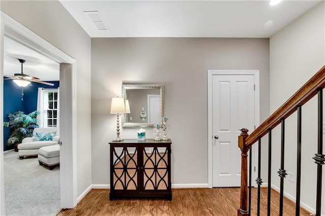 3663 Brookhaven Manor Xing NE, Atlanta, GA 30319 - hallway featuring wood finished floors, baseboards, and stairs