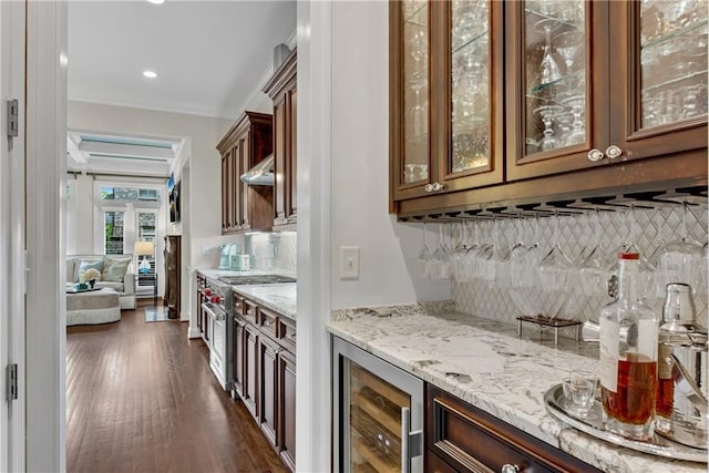 3663 Brookhaven Manor Xing NE, Atlanta, GA 30319 - indoor dry bar with stainless steel range, dark wood-style flooring, backsplash, wine cooler, and wall chimney exhaust hood