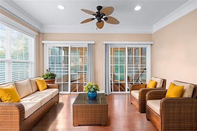 sunroom / solarium featuring ceiling fan