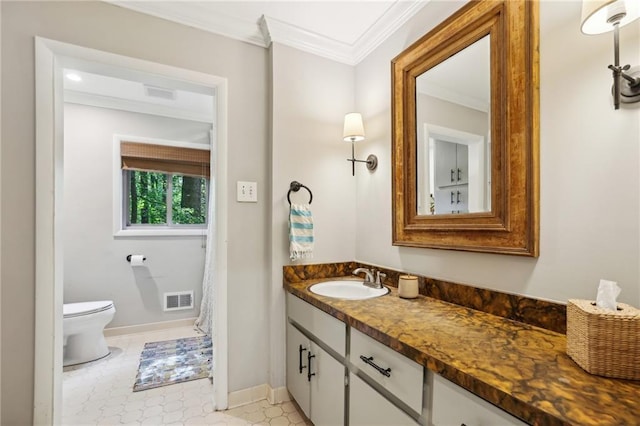 bathroom with visible vents, vanity, baseboards, toilet, and ornamental molding