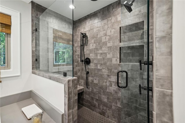 full bathroom featuring plenty of natural light, recessed lighting, and a stall shower
