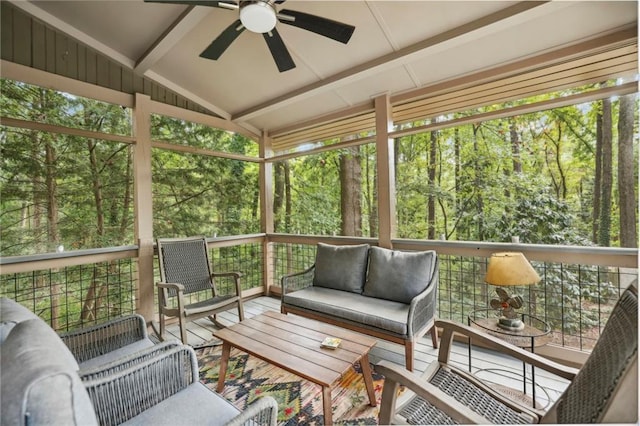 sunroom with ceiling fan, an outdoor hangout area, and beam ceiling
