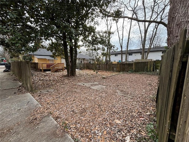 view of yard with a wooden deck