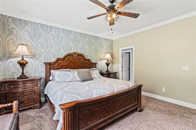 carpeted bedroom with baseboards, crown molding, and a ceiling fan