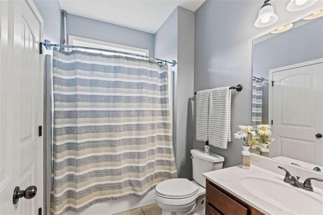 full bathroom featuring toilet, vanity, and curtained shower