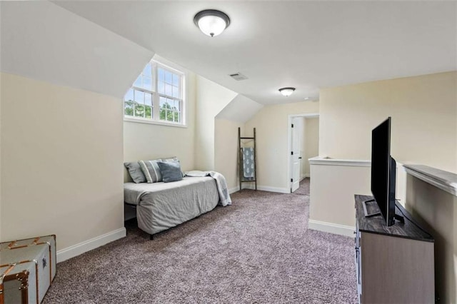 bedroom with carpet floors, baseboards, and lofted ceiling