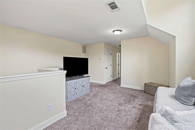 living area featuring carpet floors and baseboards