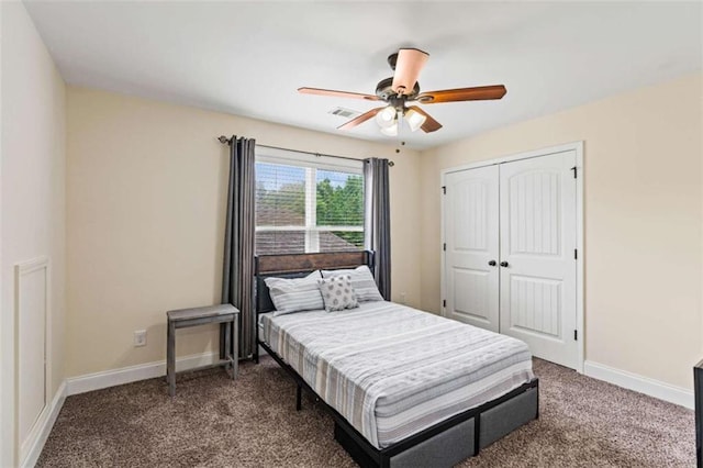 bedroom featuring carpet floors, a closet, baseboards, and a ceiling fan