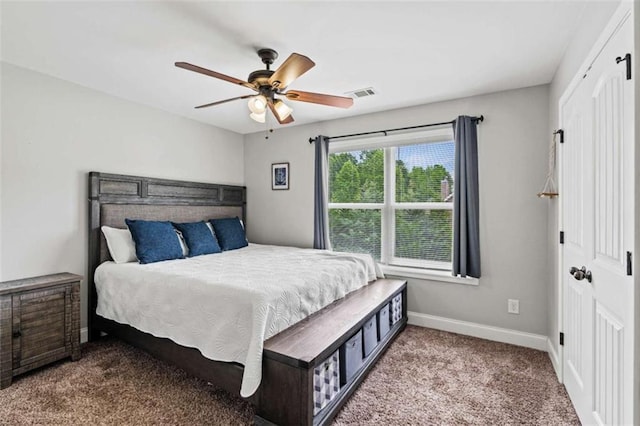 bedroom with carpet, baseboards, and a ceiling fan