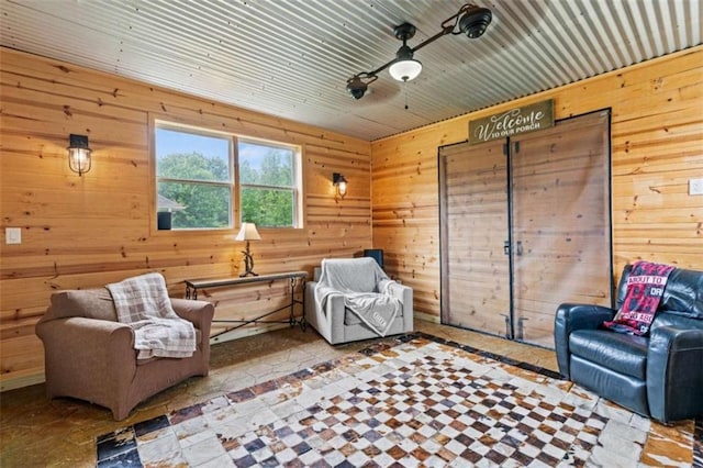 sitting room with wood walls