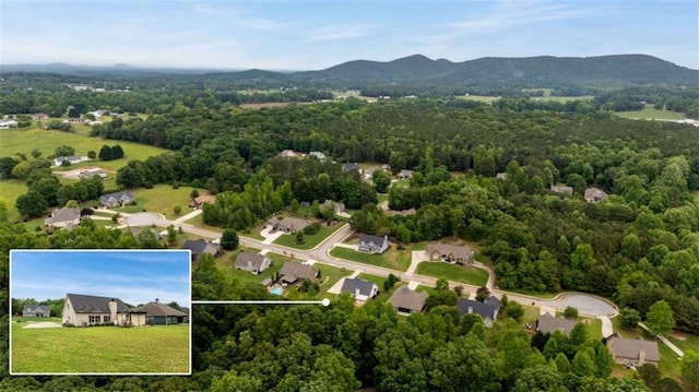 view of property location featuring property parcel outlined, a forest, and a mountainous background