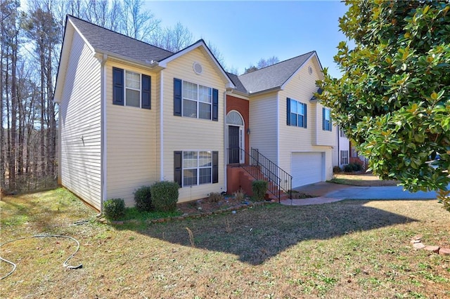 split foyer home with driveway and an attached garage