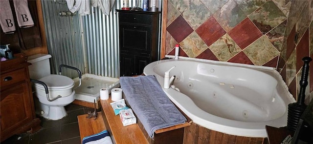 bathroom with tile patterned flooring, a bath, and toilet