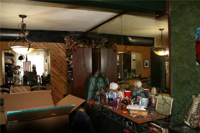 dining room featuring wooden walls