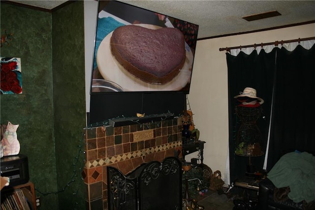 room details featuring crown molding and a textured ceiling