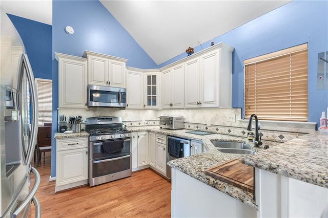 kitchen with white cabinetry and appliances with stainless steel finishes