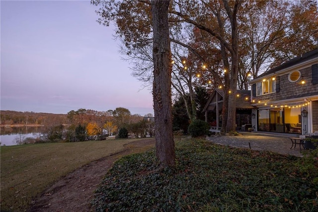 4252 Tall Hickory Trl, Gainesville, GA 30506 - view of green lawn featuring a patio area and a water view