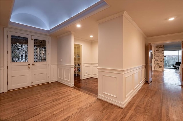 4252 Tall Hickory Trl, Gainesville, GA 30506 - entryway with light wood-type flooring, crown molding, a decorative wall, a wainscoted wall, and recessed lighting