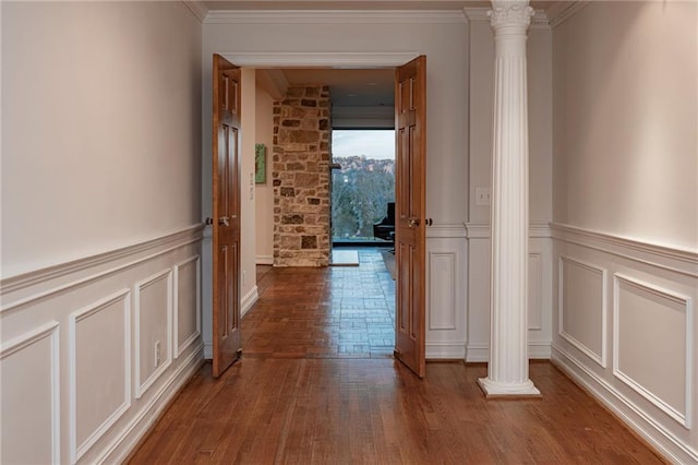 4252 Tall Hickory Trl, Gainesville, GA 30506 - hallway with decorative columns, a decorative wall, wood finished floors, ornamental molding, and wainscoting