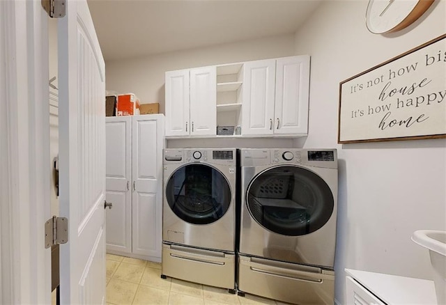 3311 Lindenridge Dr, Buford, GA 30519 - washroom featuring light tile patterned floors, cabinet space, and washer and dryer