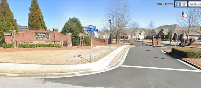 3311 Lindenridge Dr, Buford, GA 30519 - view of street featuring curbs, street lights, sidewalks, a gated entry, and a residential view