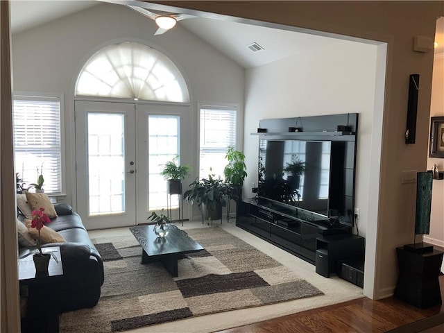 3311 Lindenridge Dr, Buford, GA 30519 - living area featuring visible vents, lofted ceiling, wood finished floors, ceiling fan, and french doors