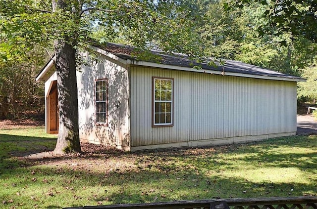 view of side of home featuring a yard