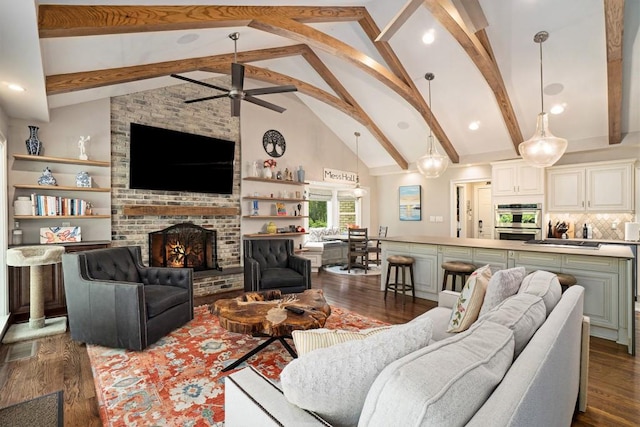7265 Hunters Branch Dr, Sandy Springs, GA 30328 - living room featuring dark wood-type flooring, beam ceiling, ceiling fan, a brick fireplace, and high vaulted ceiling